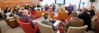 Academics taking part in research seminar