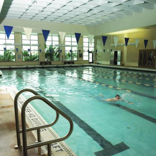Student make use of the pool in the University's state-of-the-art gym, the Herbert Wellness Center.