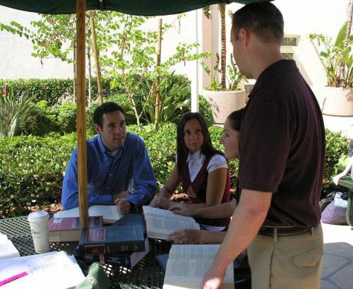 Students studying on the law school patio.