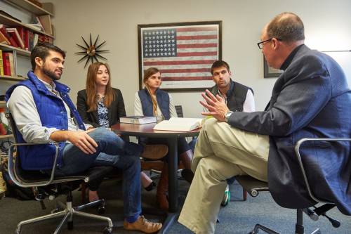 Students meet with a UConn Law Professor.